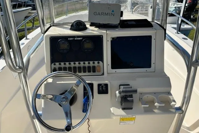 Slide: The Image of Center console of a 2005 Key West 225 boat with Garmin navigation system. - 14