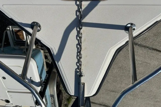 Slide: The Image of Bow view of a 2005 Key West 225 Center Console boat with anchor chain and railings. - 9