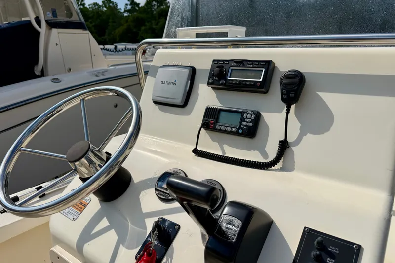 Slide: The Image of Steering console of 2012 Jones Brothers Bateau 20 with Garmin GPS and communication devices. - 5