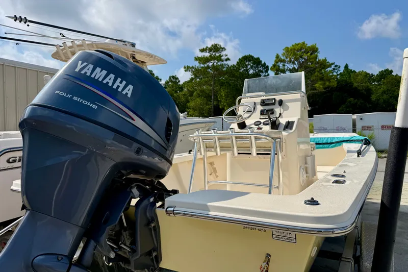 Slide: The Image of 2012 Jones Brothers Bateau 20 boat with Yamaha four-stroke engine, parked outdoors. - 3