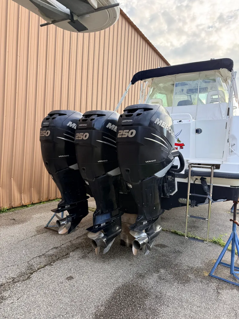 Slide: The Image of A 2013 Boston Whaler 345 Conquest with three Mercury 250 outboard engines. - 4