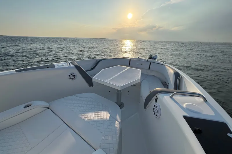 Slide: The Image of 2026 Wellcraft 38 T-Top boat interior with sunset view over the ocean. - 20