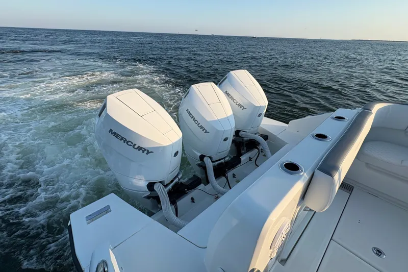 Slide: The Image of 2026 Wellcraft 38 T-Top boat with triple Mercury outboard engines on open water. - 17
