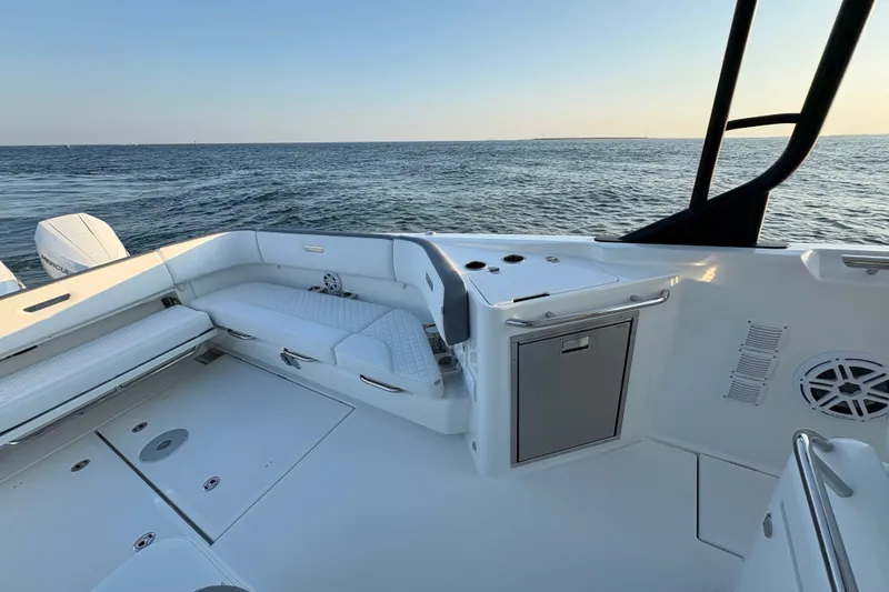 Slide: The Image of 2026 Wellcraft 38 T-Top boat interior with seating and ocean view. - 19