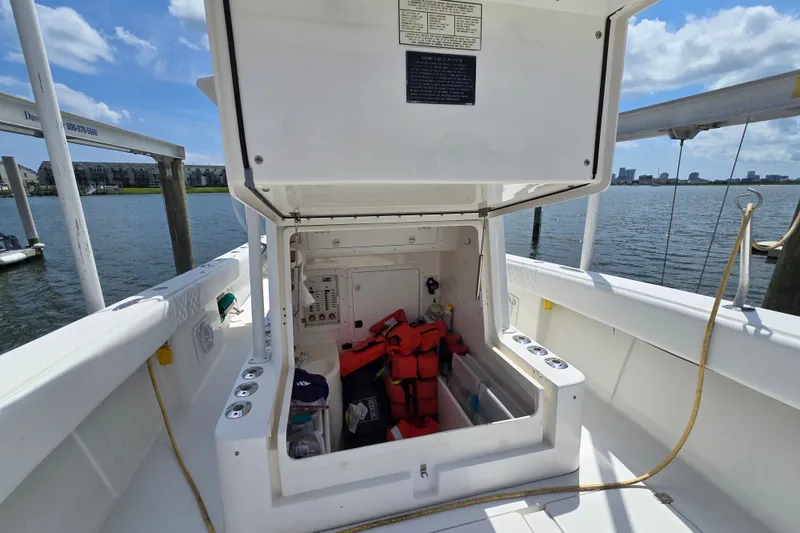 Slide: The Image of 2006 SeaVee 340B boat storage compartment open, revealing life jackets and equipment. - 20