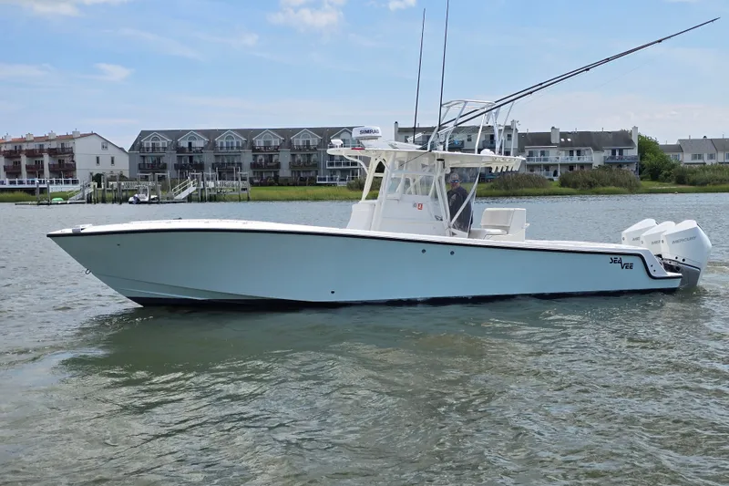 The Image of 2006 SeaVee 340B boat on water, with residential buildings in the background. - 0