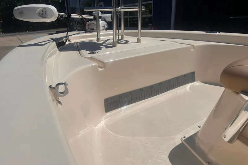 Slide: The Image of 2022 Ocean Scout Sport 177 boat interior with measuring ruler and seating. - 13