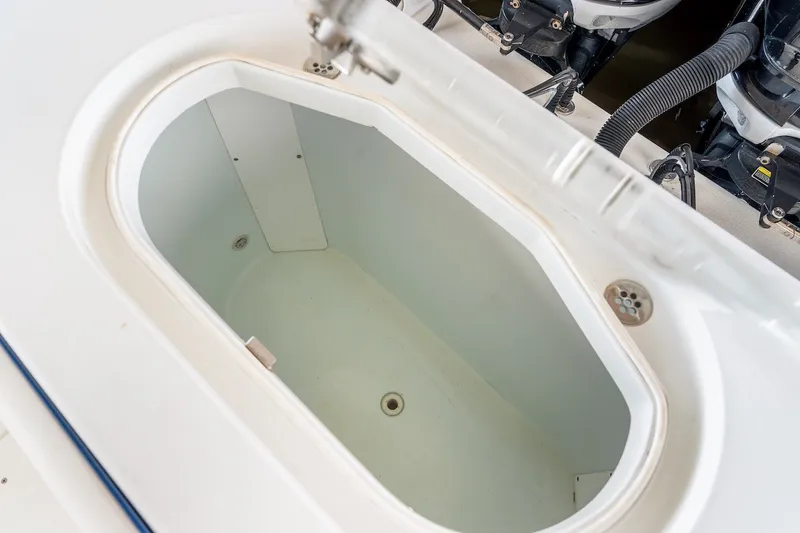 Slide: The Image of Livewell compartment on a 2013 Yellowfin 39 Offshore boat, showcasing interior and drainage features. - 63