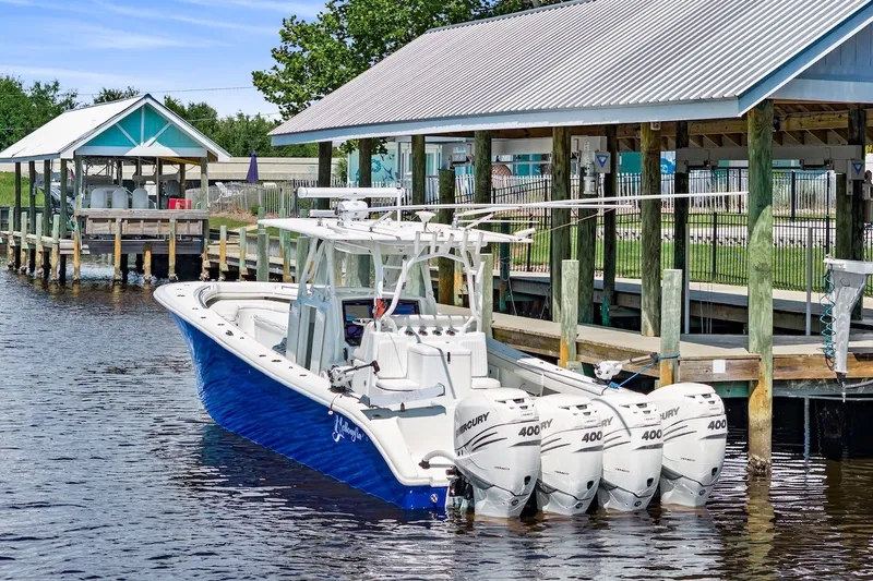 Slide: The Image of 2013 Yellowfin 39 Offshore boat docked with four Mercury 400 engines. - 13