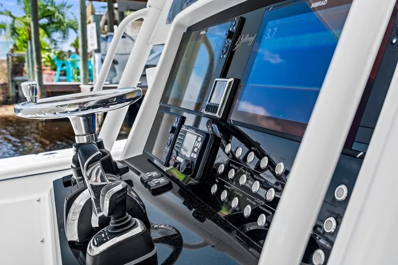 Slide: The Image of Control panel of a 2013 Yellowfin 39 Offshore boat with advanced navigation systems. - 51