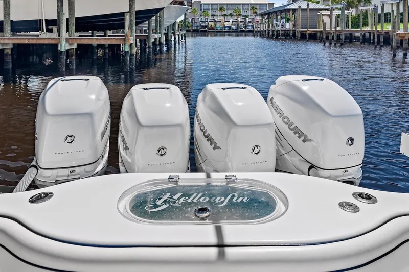Slide: The Image of 2013 Yellowfin 39 Offshore boat with four Mercury outboard engines docked in marina. - 42