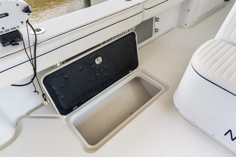 Slide: The Image of Open storage compartment on 2013 Yellowfin 39 Offshore boat deck. - 62