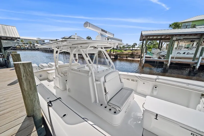 Slide: The Image of 2013 Yellowfin 39 Offshore boat docked, featuring spacious deck and modern design. - 36