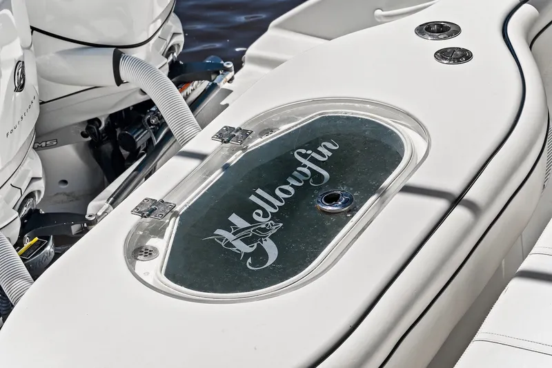 Slide: The Image of 2013 Yellowfin 39 Offshore boat deck with logo and engine details. - 24