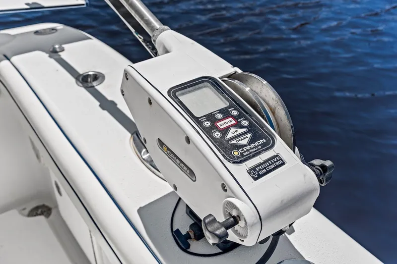 Slide: The Image of Close-up of a Cannon downrigger on a 2013 Yellowfin 39 Offshore boat. - 25