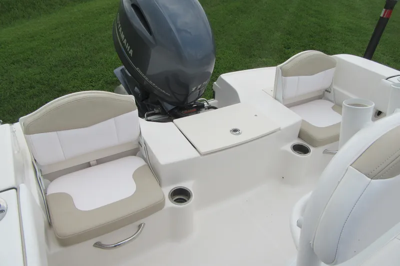 Slide: The Image of 2018 Robalo R180 Center Console boat interior with seating and Yamaha engine. - 16