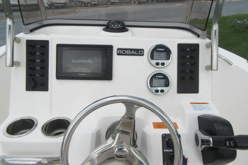 Slide: The Image of 2018 Robalo R180 Center Console dashboard with Garmin display and Yamaha gauges. - 15