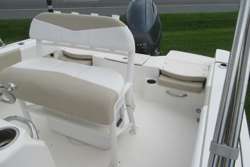 Slide: The Image of 2018 Robalo R180 Center Console boat interior with seating and motor. - 13