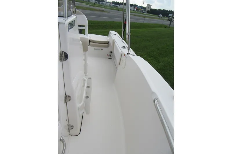 Slide: The Image of 2018 Robalo R180 Center Console boat deck with seating and rod holders. - 10