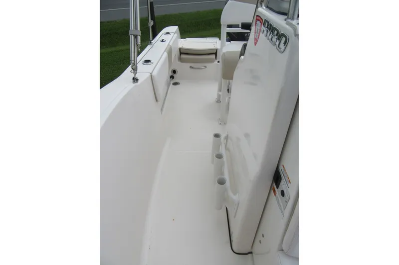 Slide: The Image of 2018 Robalo R180 Center Console boat interior with rod holders and seating. - 11