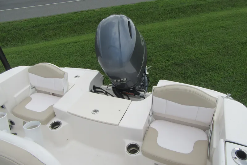 Slide: The Image of 2018 Robalo R180 Center Console boat with dual seats and outboard motor. - 17