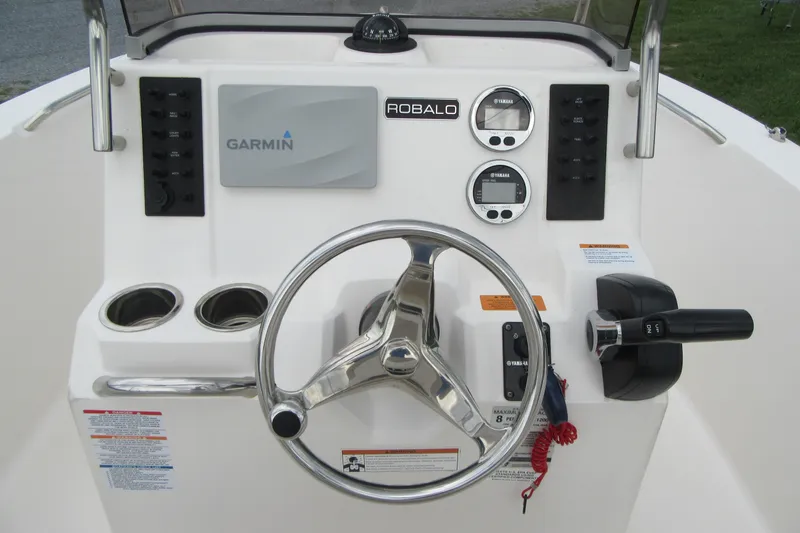 Slide: The Image of 2018 Robalo R180 Center Console dashboard with Garmin display and Yamaha gauges. - 14