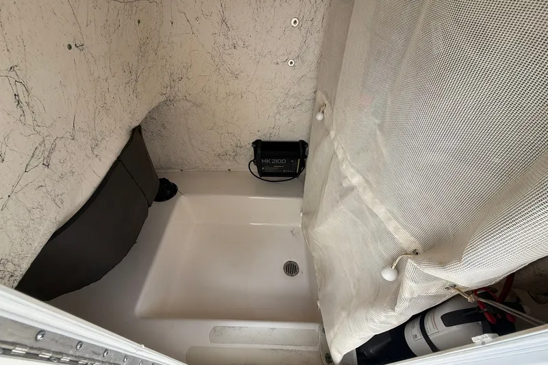 Slide: The Image of Interior of 2013 Tidewater 230 CC Adventure boat with storage and equipment. - 21