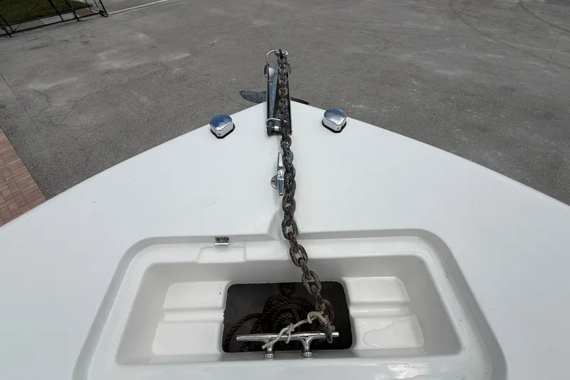 Slide: The Image of Bow of 2013 Tidewater 230 CC Adventure with anchor chain and cleat. - 17