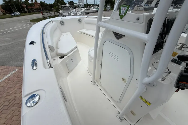 Slide: The Image of 2013 Tidewater 230 CC Adventure boat interior with seating and console. - 15