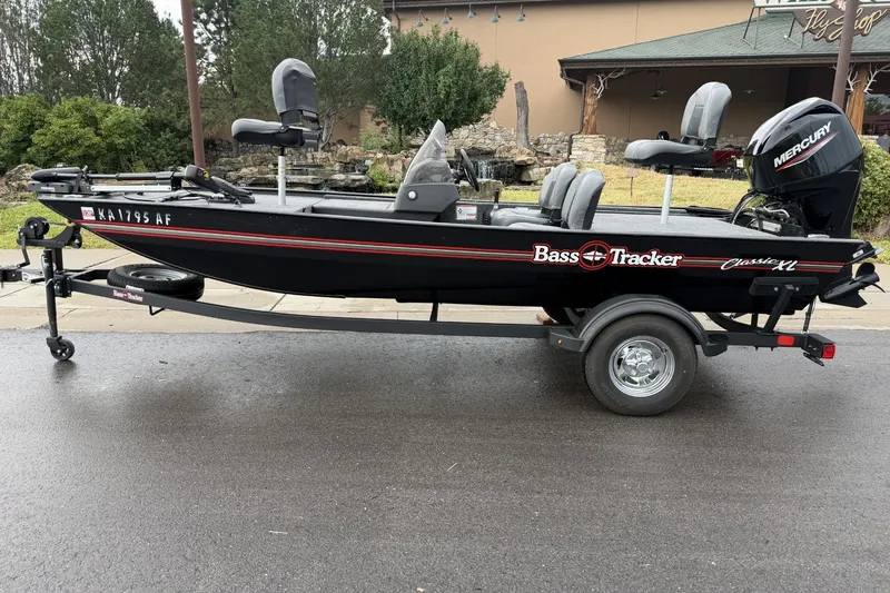 The Image of 2025 Tracker Bass Tracker Classic XL boat on trailer, parked outdoors. - 0
