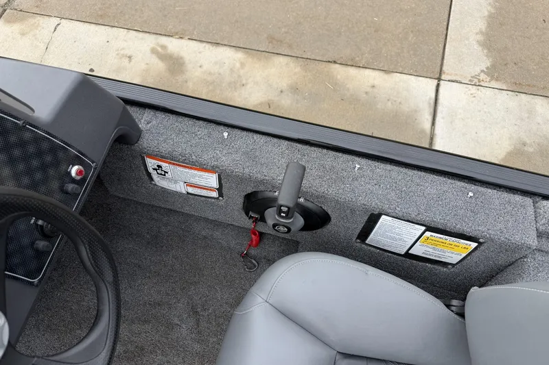 Slide: The Image of Interior view of 2025 Tracker Bass Tracker Classic XL boat cockpit area. - 18