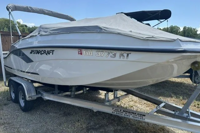 Slide: The Image of 2022 Starcraft SVX 191 OB boat on trailer, covered, with registration GA 3773 KT. - 28