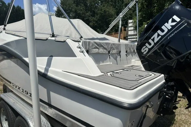 Slide: The Image of 2022 Starcraft SVX 191 OB boat with Suzuki outboard motor on trailer. - 29