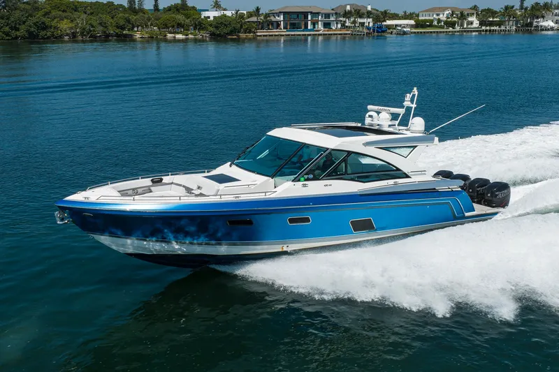 Slide: The Image of 2019 Formula 430 Super Sport Crossover cruising on a serene blue waterway. - 74