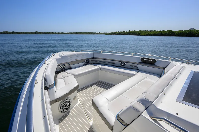 Slide: The Image of 2019 Formula 430 Super Sport Crossover boat with spacious seating on calm water. - 42