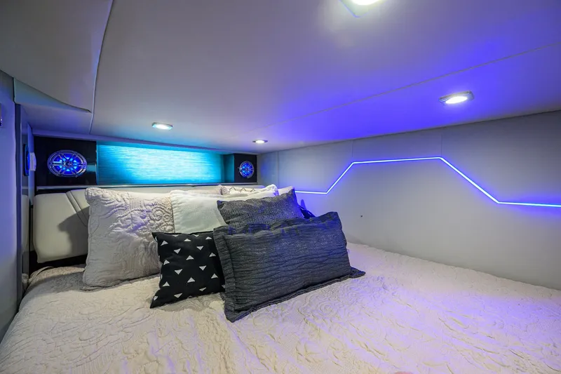Slide: The Image of Luxurious cabin interior of 2019 Formula 430 Super Sport Crossover with ambient blue lighting. - 91