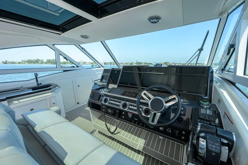 Slide: The Image of 2019 Formula 430 Super Sport Crossover helm with modern controls and panoramic windows. - 36