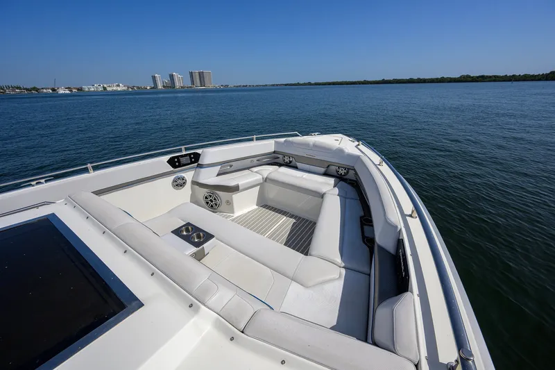 Slide: The Image of 2019 Formula 430 Super Sport Crossover boat with spacious seating on calm water. - 44