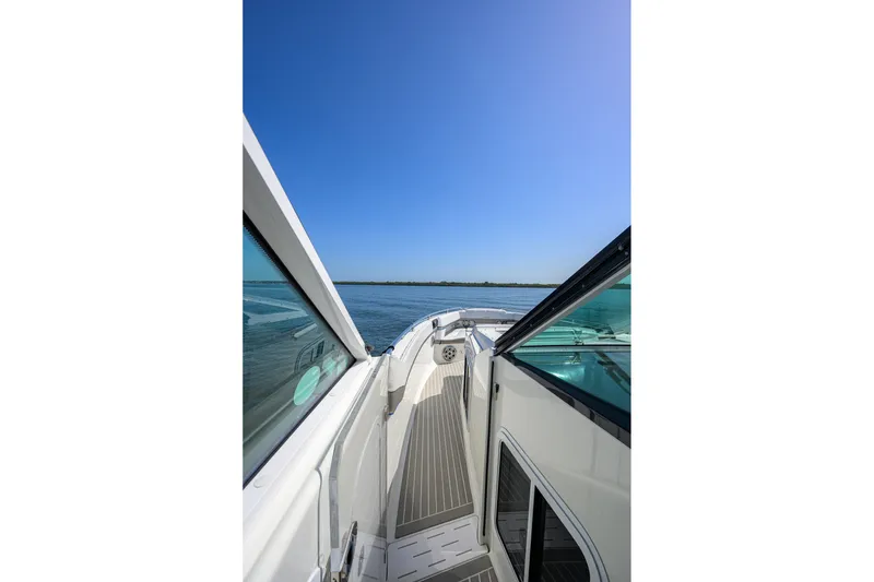 Slide: The Image of 2019 Formula 430 Super Sport Crossover yacht deck with clear blue sky and water view. - 40