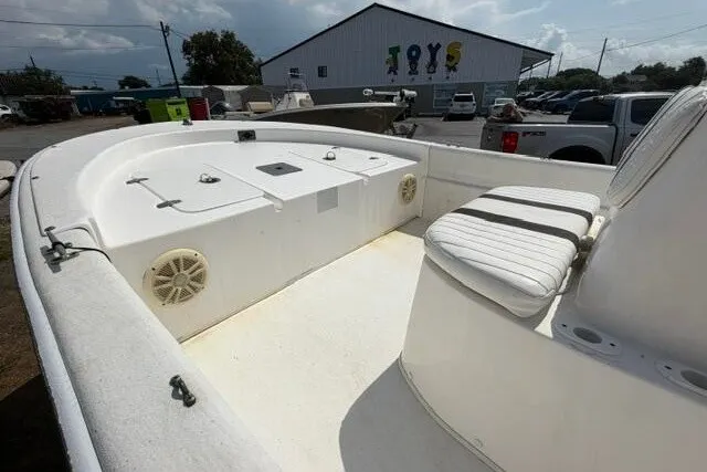 Slide: The Image of 2011 Carolina Skiff JVX18CC boat interior with seating and storage compartments. - 8