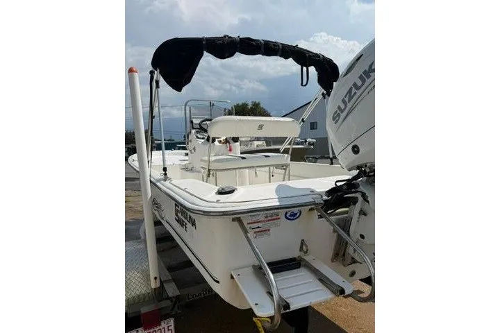 Slide: The Image of 2011 Carolina Skiff JVX18CC boat with Suzuki outboard motor on trailer. - 5