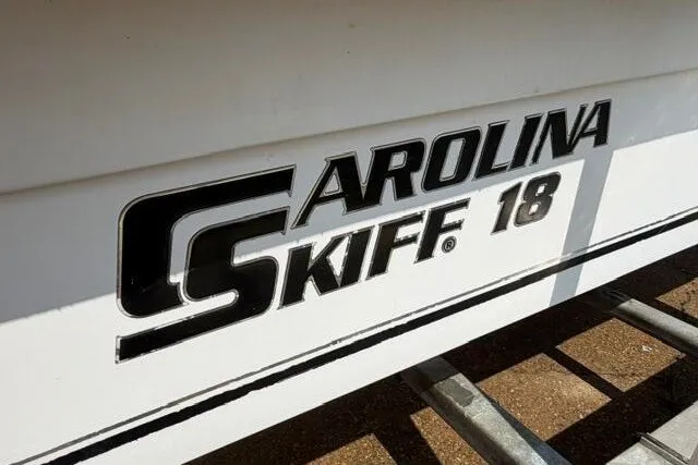 Slide: The Image of 2011 Carolina Skiff JVX18CC boat logo on hull, close-up view. - 3