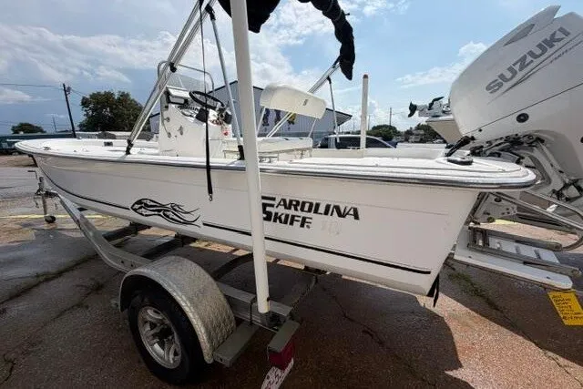 Slide: The Image of 2011 Carolina Skiff JVX18CC boat on trailer with Suzuki outboard motor. - 7