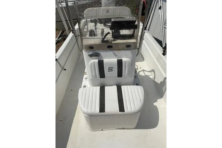 Slide: The Image of 2011 Carolina Skiff JVX18CC boat interior with white seating and console. - 14