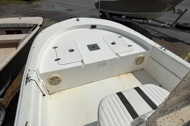 Slide: The Image of 2011 Carolina Skiff JVX18CC boat interior with seating and storage compartments. - 13