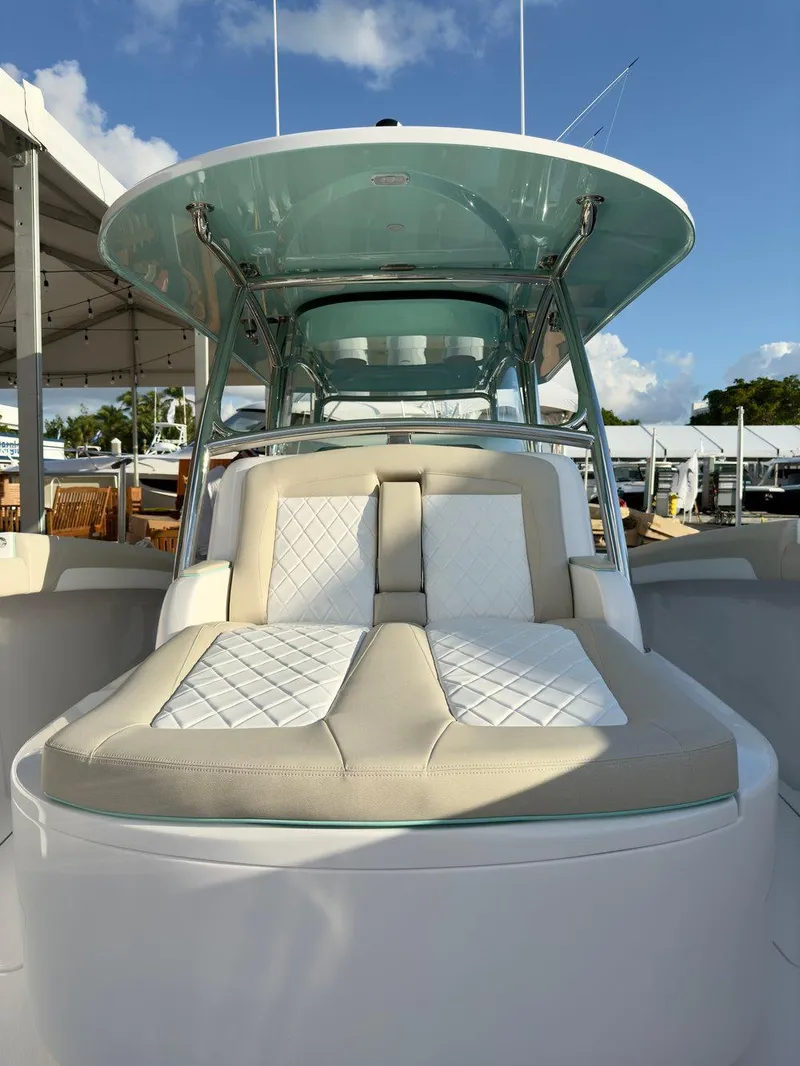 Slide: The Image of 2025 Mag Bay 38 CC boat with luxurious seating and sleek design. - 16