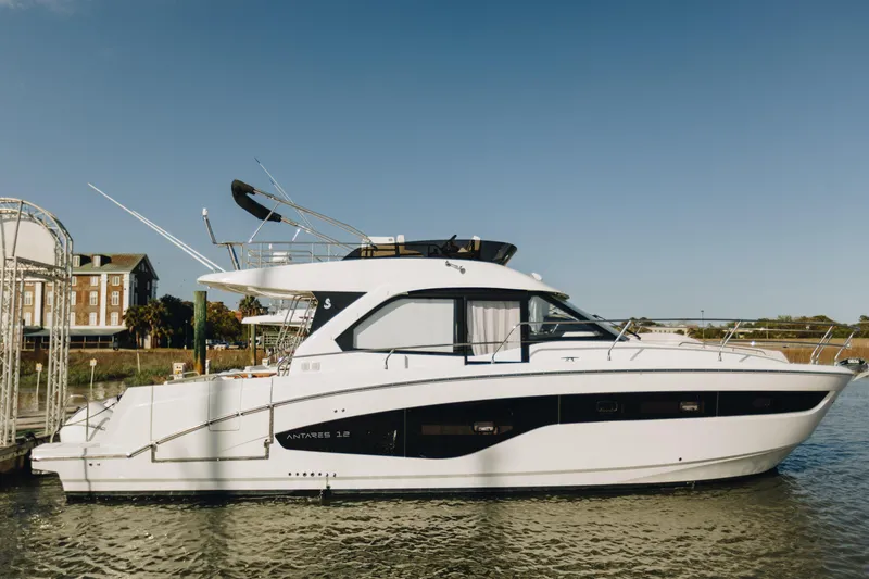 The Image of 2026 Beneteau Antares 12 Fly yacht docked on a sunny day. - 0
