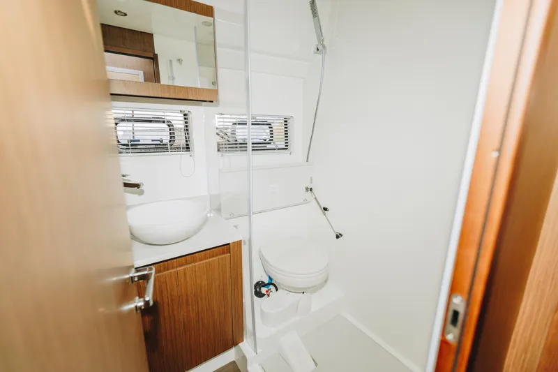 Slide: The Image of Bathroom interior of 2026 Beneteau Antares 12 Fly yacht, featuring modern fixtures. - 17