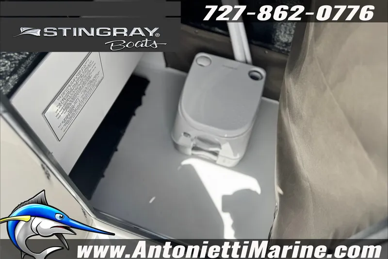 Slide: The Image of 2027 Stingray 17 CC boat interior with portable toilet, contact details, and website. - 18