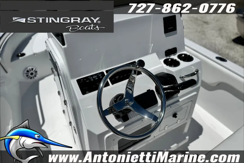 Slide: The Image of 2027 Stingray 17 CC boat dashboard with steering wheel and controls, featuring Antonietti Marine branding. - 20